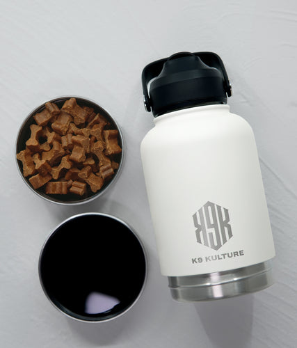 Off White ThermoACTIVE insulated dog water bottle displayed with dual compartments—one filled with water, one with treats.